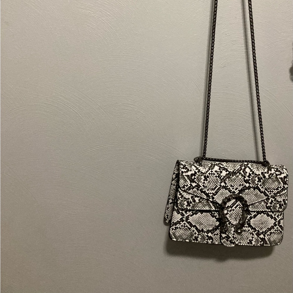 Snake skin handbag with gun metal hardware